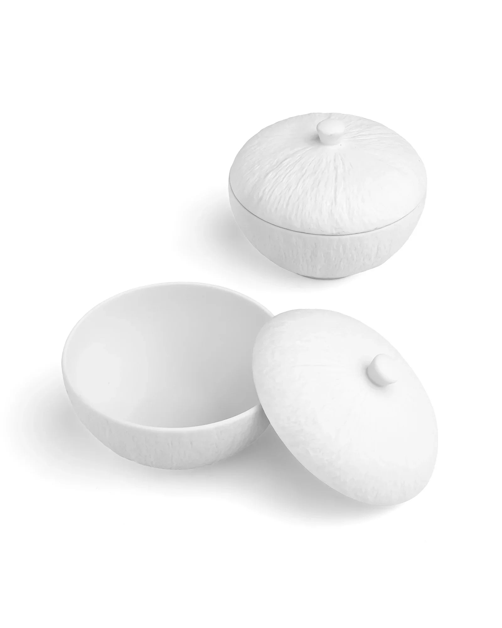 Premium white porcelain bowls with textured lids from Vola Global on a white background